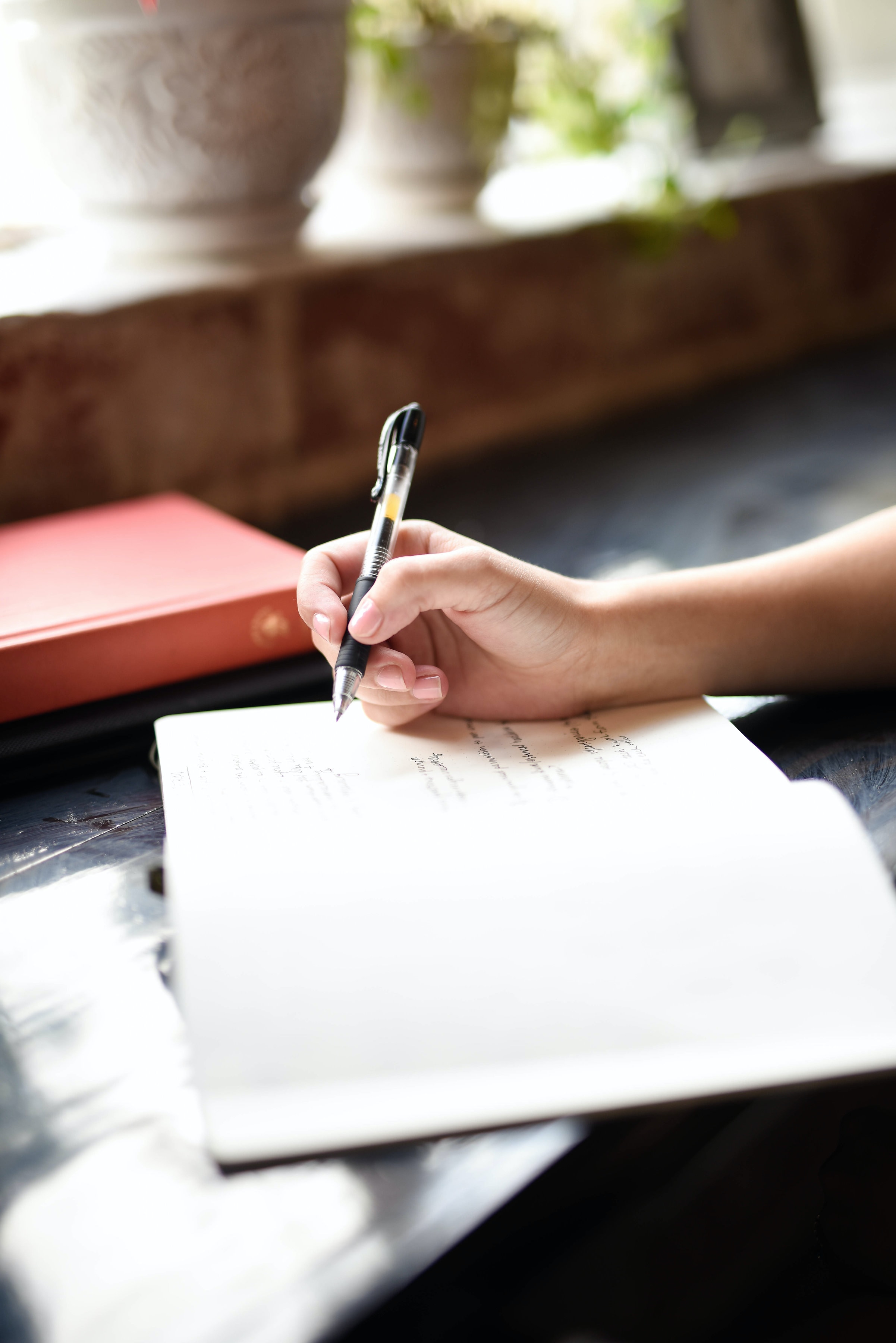 Person writing into journal